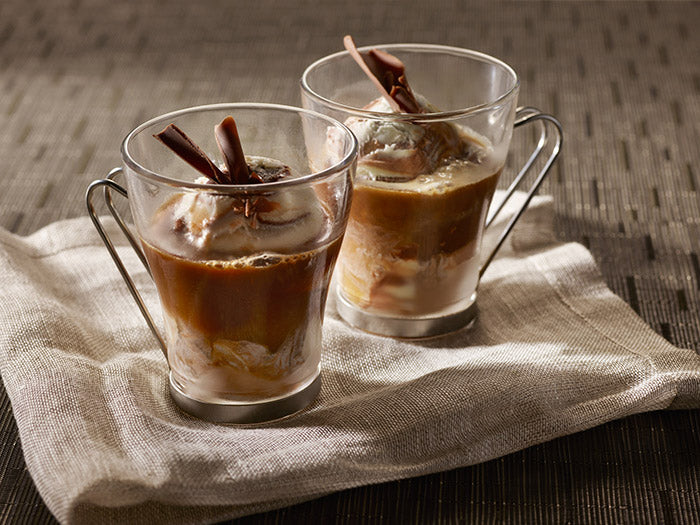 two glasses of coffee dessert on napkin