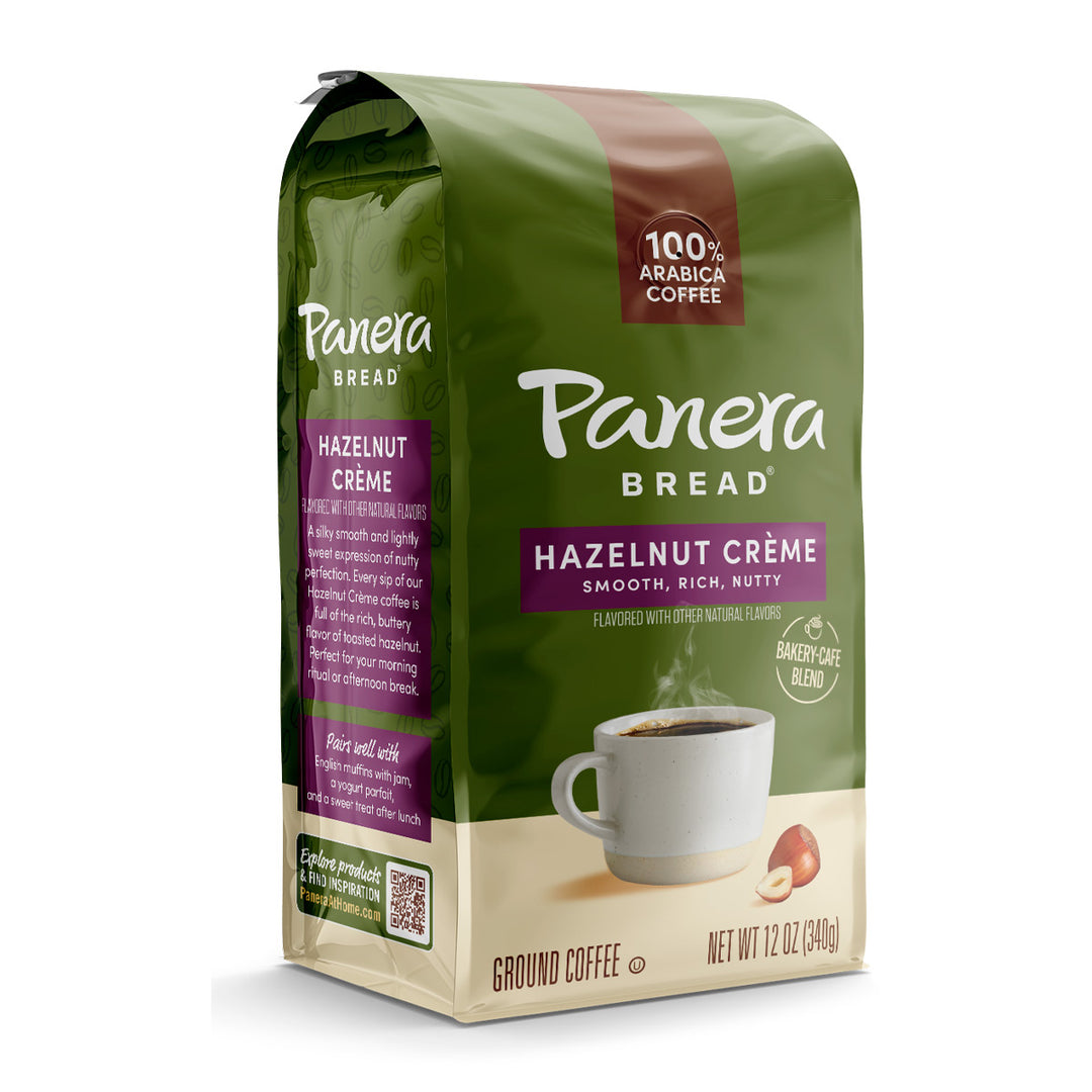 Panera Hazelnut creme green bag with coffee mug on front shot at an angle